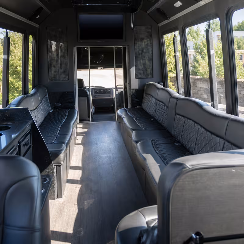 Friends laughing during a Lakewood party bus celebration