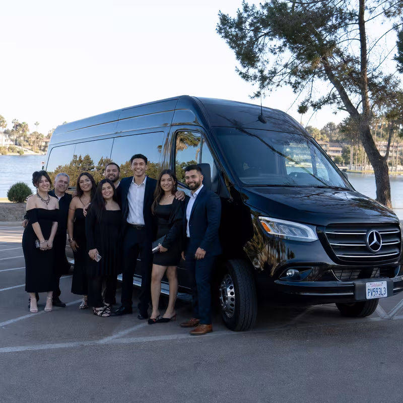Group beside a Mercedes Sprinter limo from the Lakewood fleet