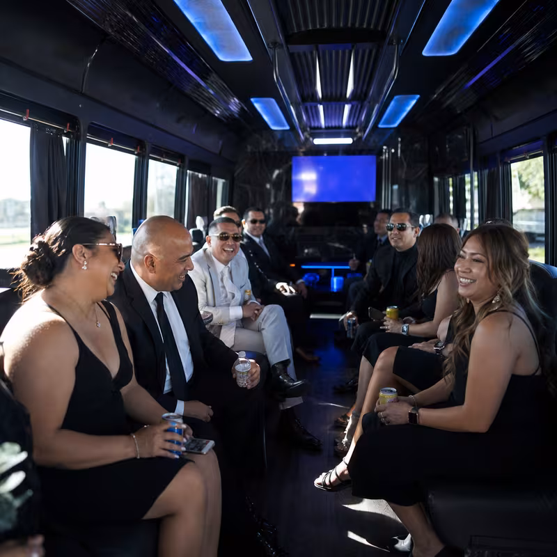 Wedding guests seated inside a Lakewood party bus