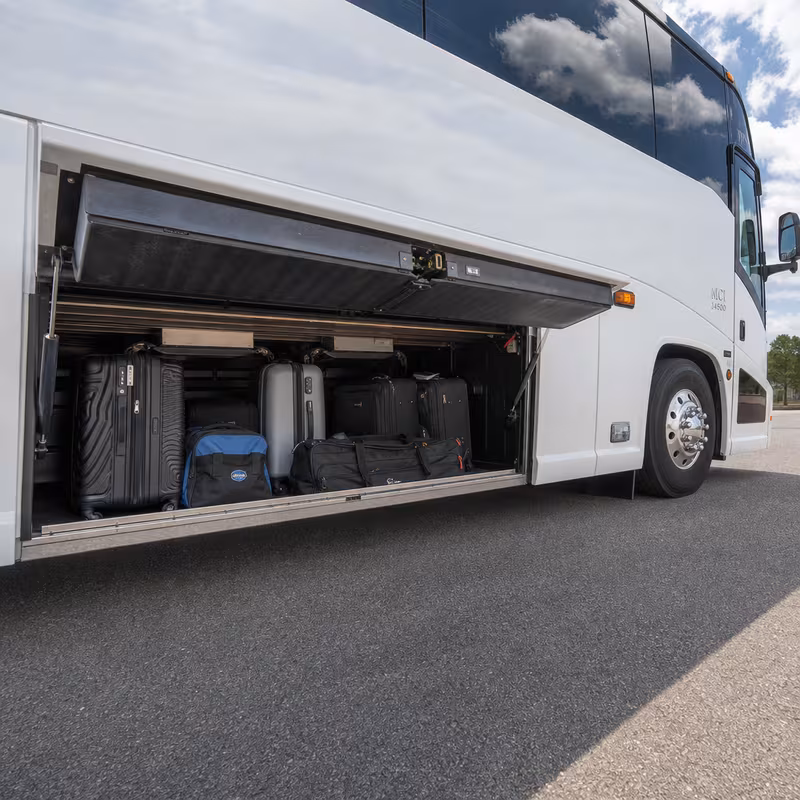 Party bus interior with wraparound leather seating and LED lighting in Lakewood