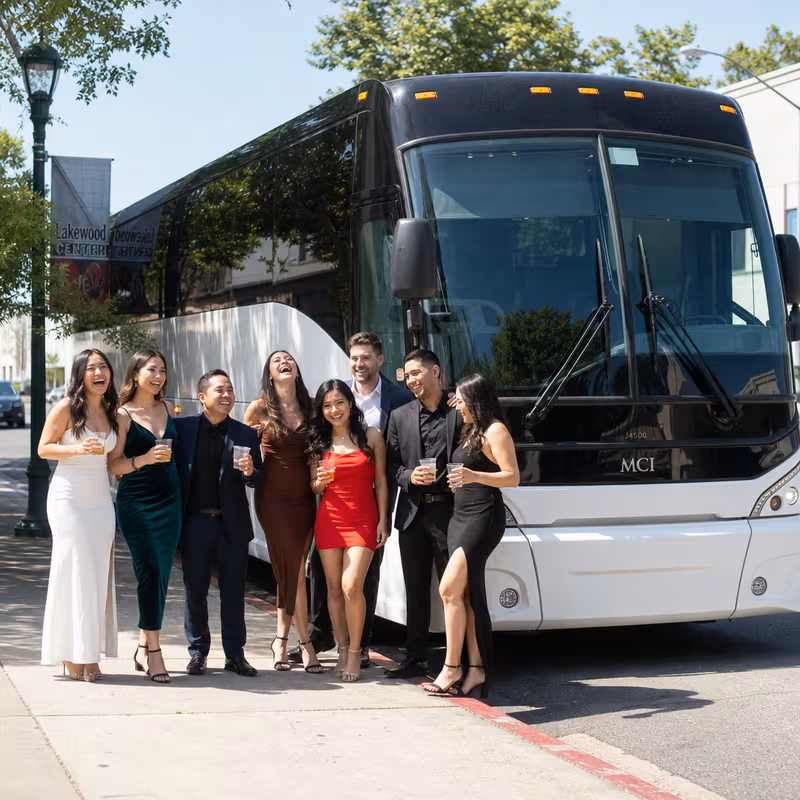 Passengers loading luggage while boarding an Lakewood group shuttle