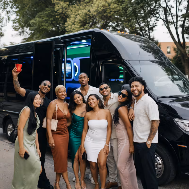 Group boarding a white charter bus for Birthday Transportation transportation in Lakewood