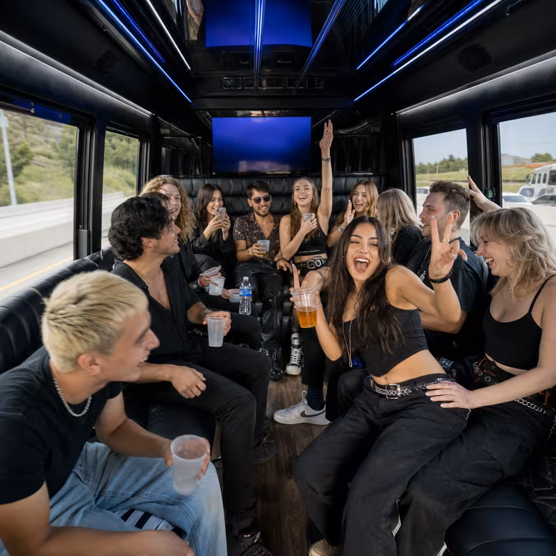 Passengers loading luggage while boarding an Lakewood group shuttle