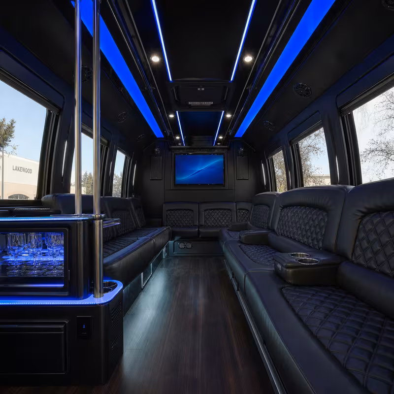 Party bus interior with wraparound leather seating and LED lighting in Lakewood