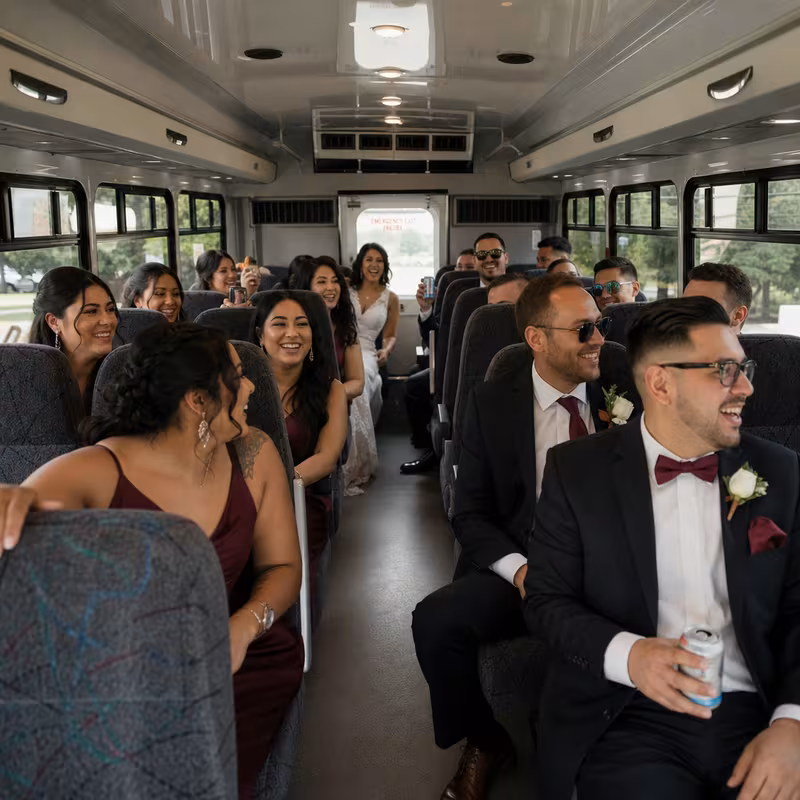 Group boarding a white charter bus for Wedding Transportation transportation in Lakewood