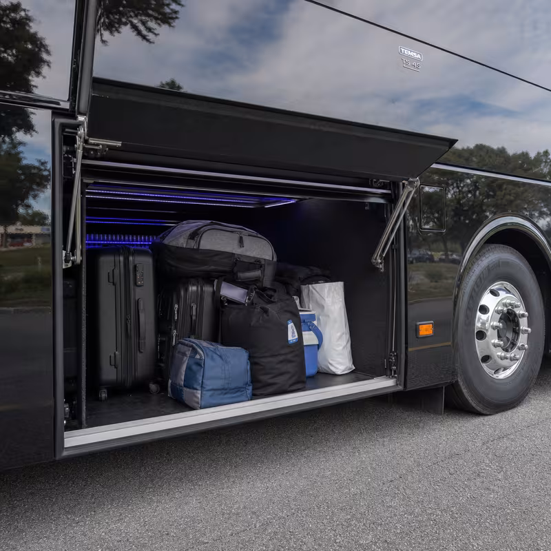 Party bus interior with wraparound leather seating and LED lighting in Lakewood