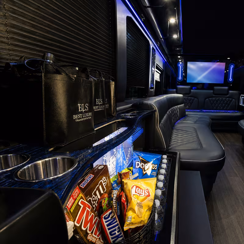 Party bus interior with wraparound leather seating and LED lighting in Lakewood
