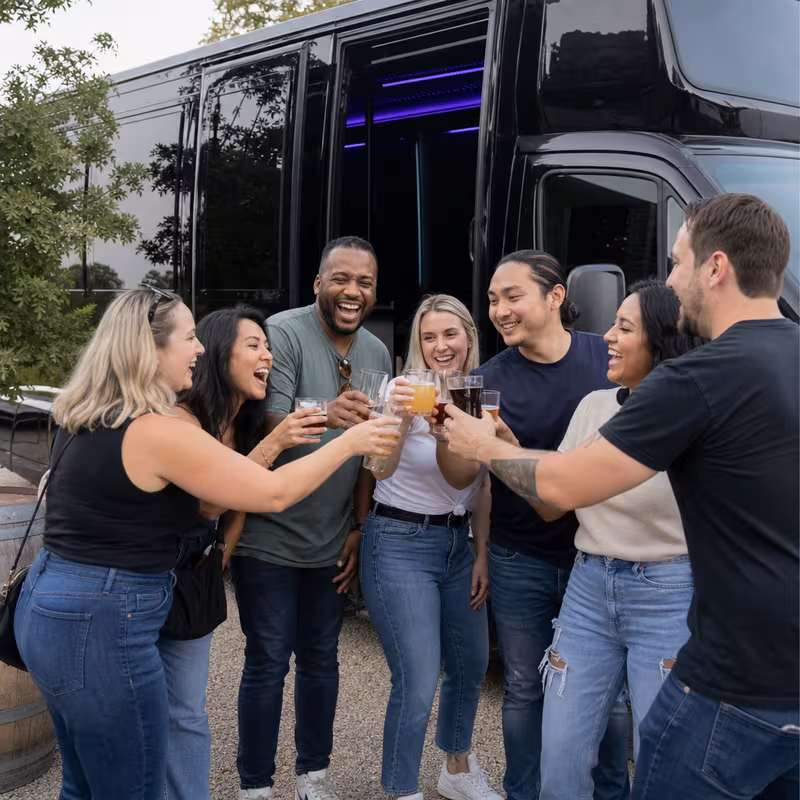 Passengers loading luggage while boarding an Lakewood group shuttle